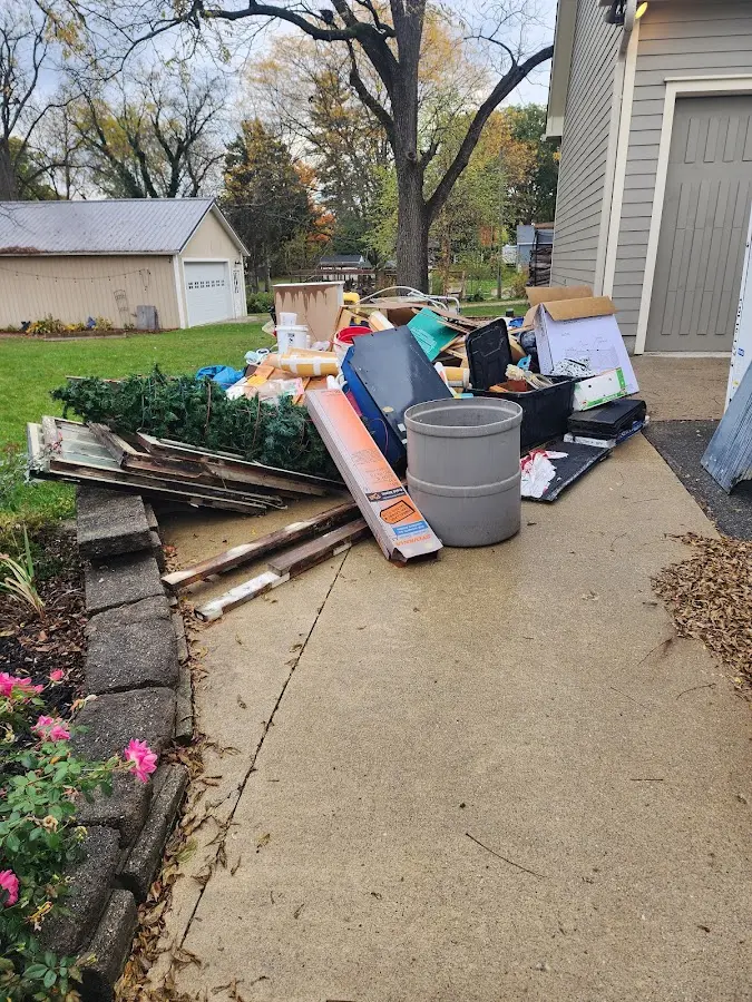Dumpster being loaded with debris for Commercial Dumpster Rental in Saluda